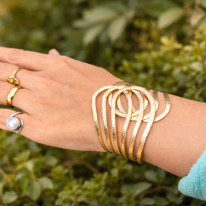 “Golden textured alloy adjustable cuff bracelet worn on wrist modern statement bracelet for women”