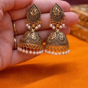 Antique gold jhumka earrings for women with pearl drops and leaf motif