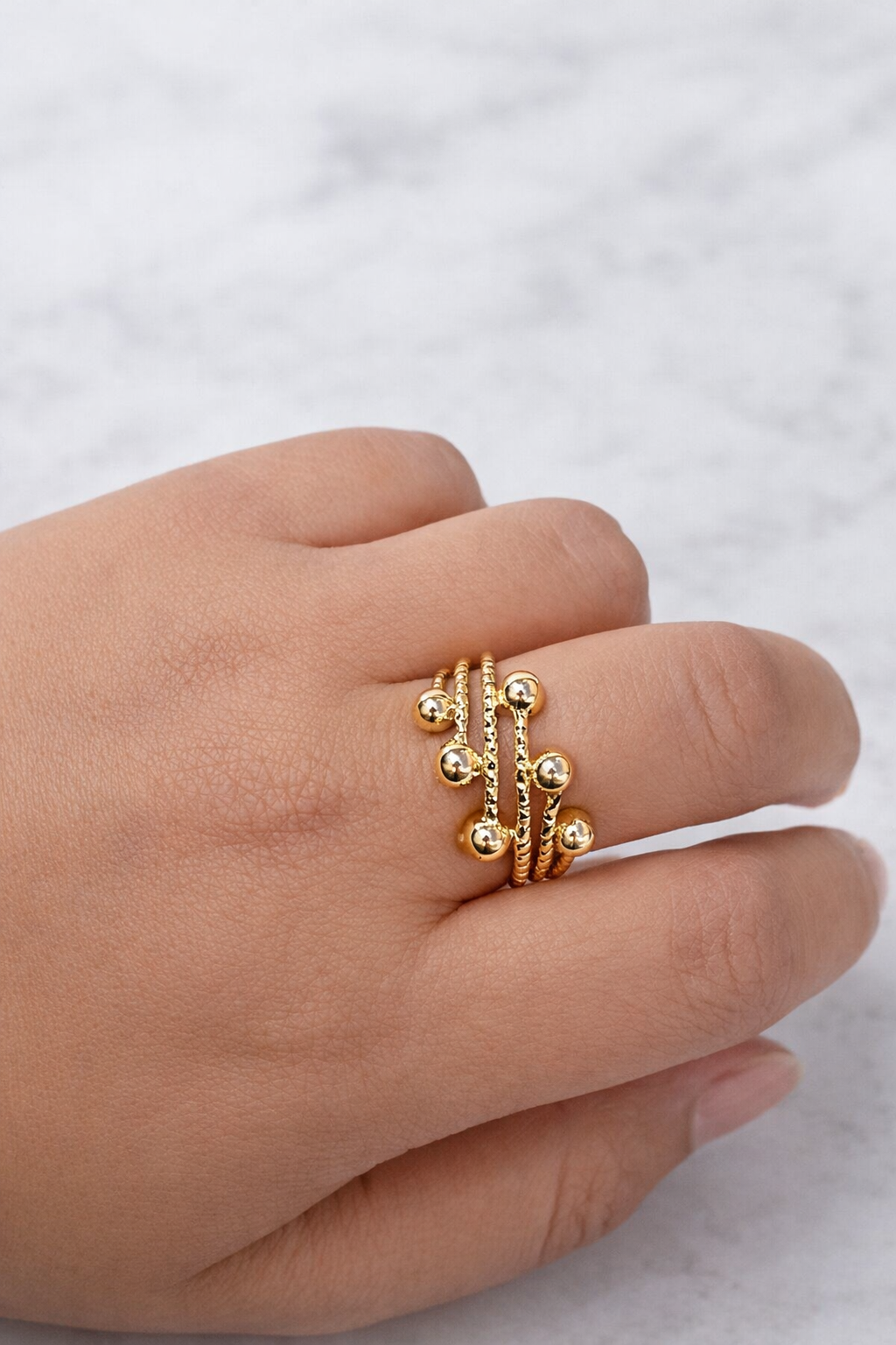 Multi-band statement ring for women with polished ball detailing