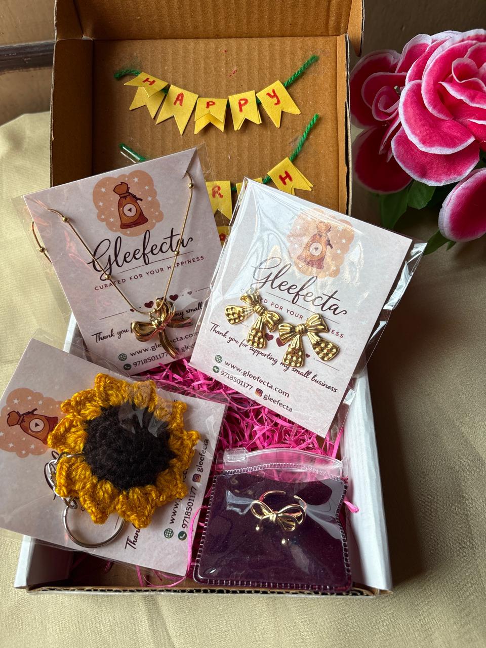 bow jewellery gift hamper with necklace earrings ring and crochet flower charm in gift box